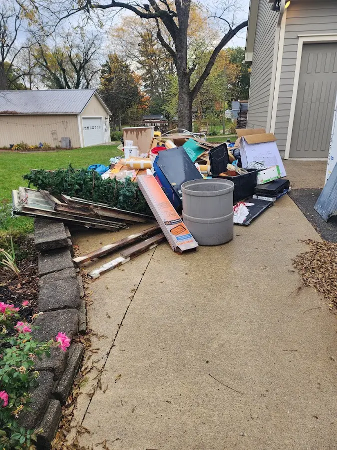 Dumpster being loaded with debris for 10 Yard Dumpster Rental in Lower Towamensing